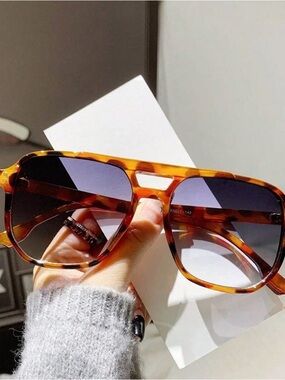 Tortoise shell sunglasses with bluish grey lens